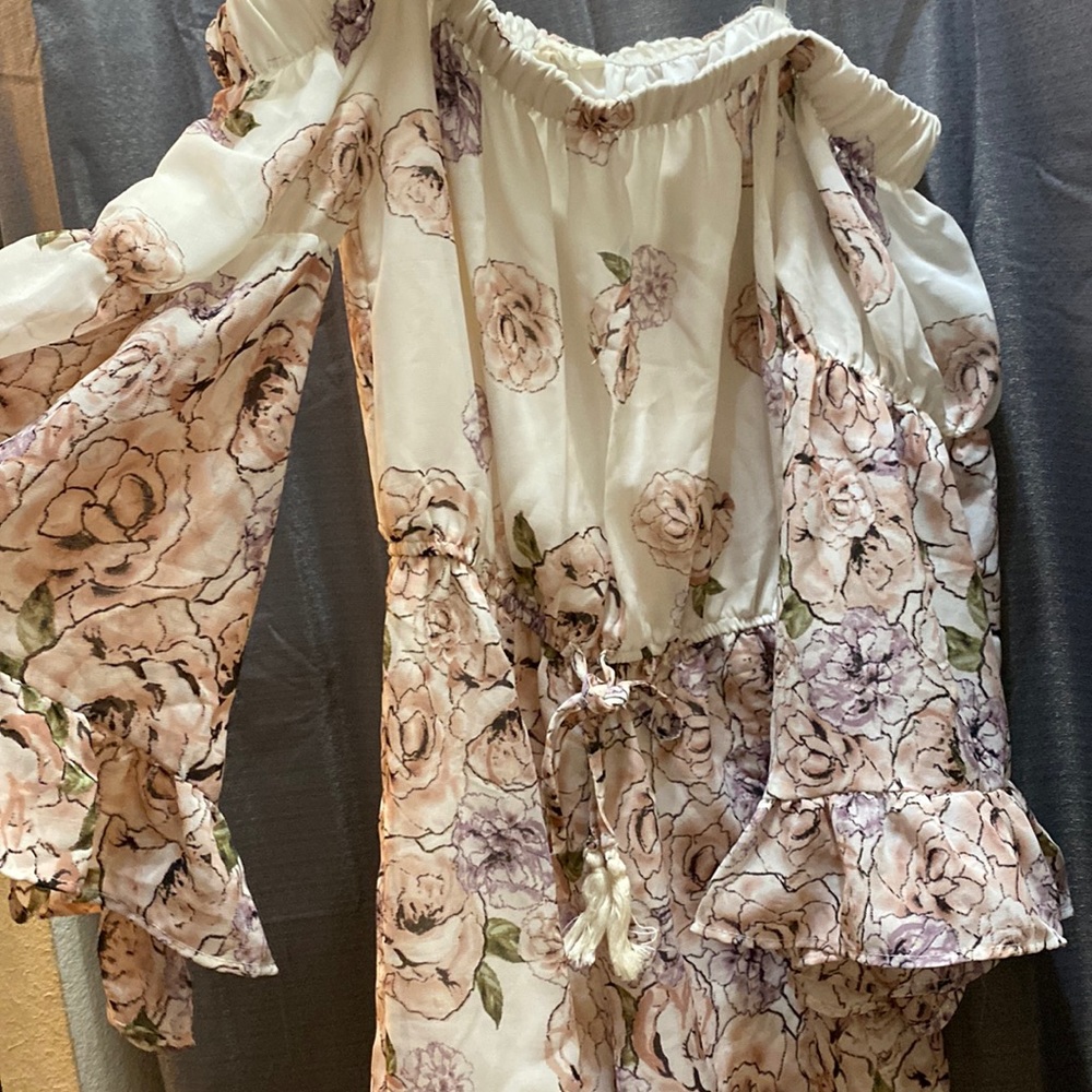 Light pink and purple flowers, main color a cream color. Brand: Hint of Blush
